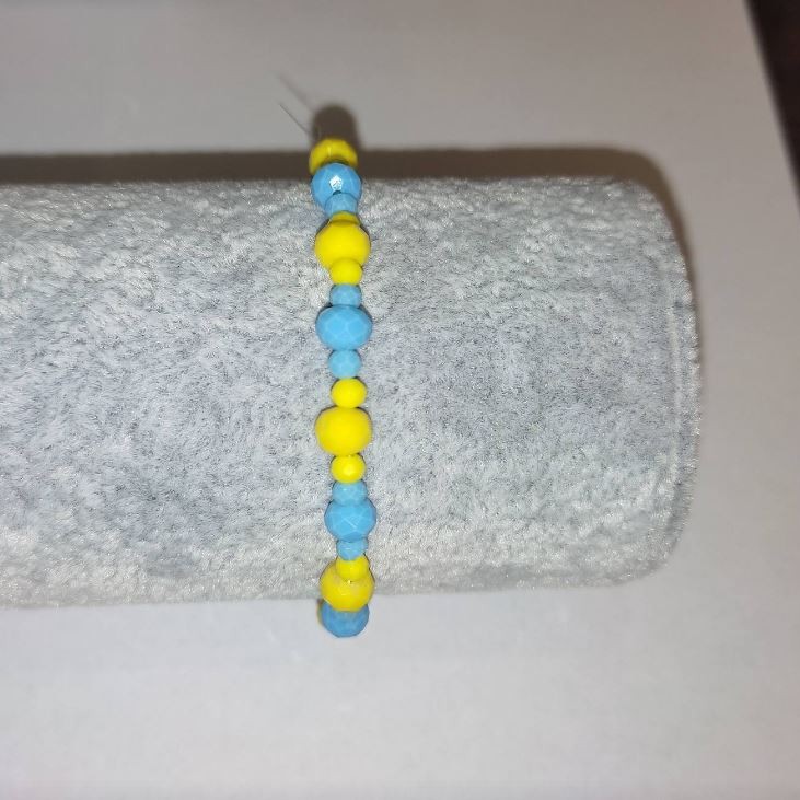 Bransoletka „Ukraina” z czeskiego kryształu fasetowany rondel na gumce, średnica 6×4 mm ±, średnica 3×2 mm ±, długość 18 cm+
