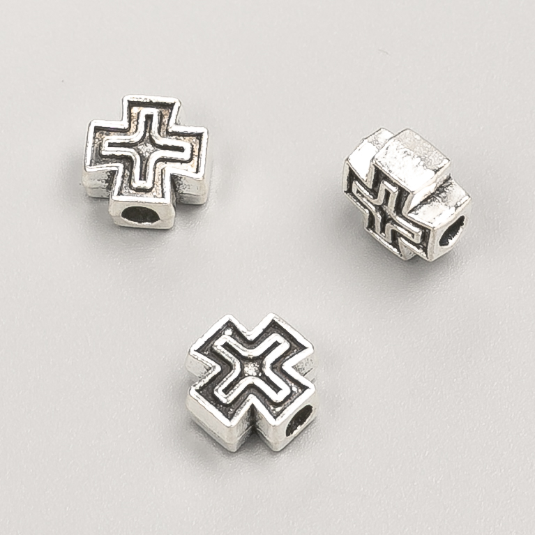Furnitura jubilerska – koralik-wstawka w kształcie krzyża, wymiary 9×9×5 mm, opakowanie 20 g, 18 szt. +/- kolor metalu „srebro”