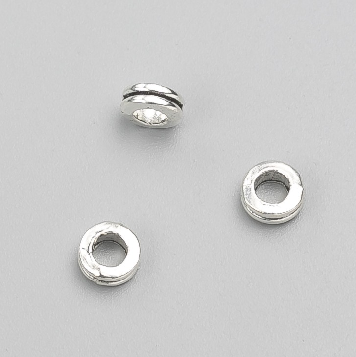 Koralik-wkładka do biżuterii, średnica 6×3 mm, opakowanie 20 g, 50 szt. ±, kolor metalu 'srebro'