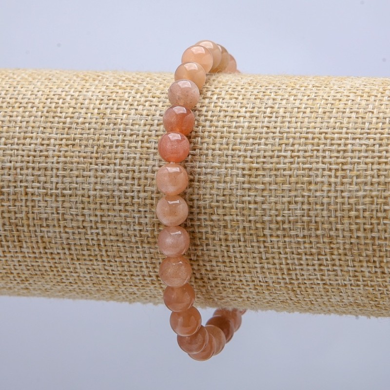 Bransoletka na gumce z naturalnym selenitem, gładkie kule o średnicy 6 mm, obwód 18 cm +