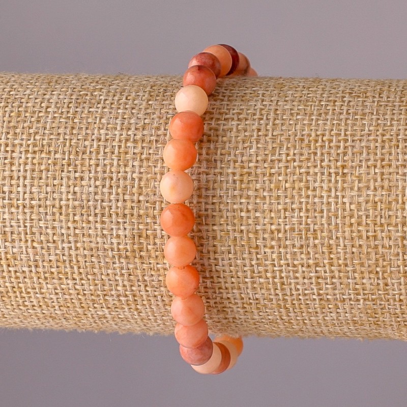 Bransoletka z selenitu na elastycznej gumce, gładkie kuleczki, średnica 6 mm, obwód 18 cm