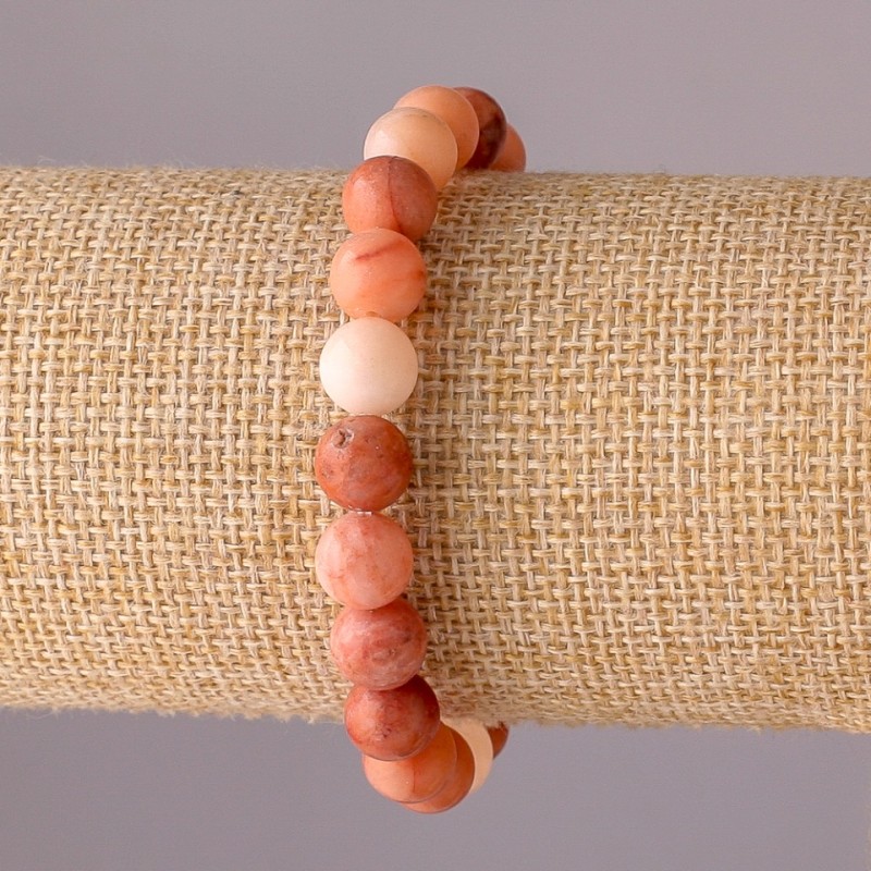 Bransoletka z selenitu na elastycznej gumce, gładkie kuleczki, średnica 8 mm, obwód 18 cm