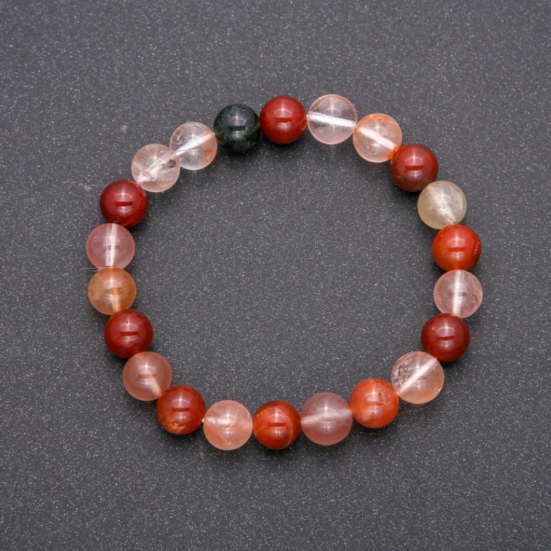 Bransoletka z naturalnego kamienia kwarc rutylowy - asortyment na gumce, gładkie kulki, średnica ok. 8 mm, długość 18 cm