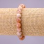 Bransoletka z naturalnego kamienia selenitu – gładka kula, średnica około 8 mm na elastycznej gumce, długość 18 cm