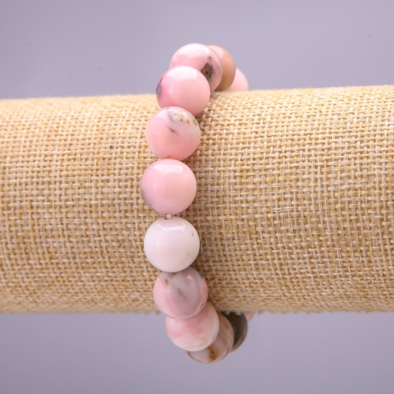Bransoletka z naturalnego kamienia – różowy opal, gładka kulka, średnica około 10 mm, na elastycznej gumce, obwód 18 cm