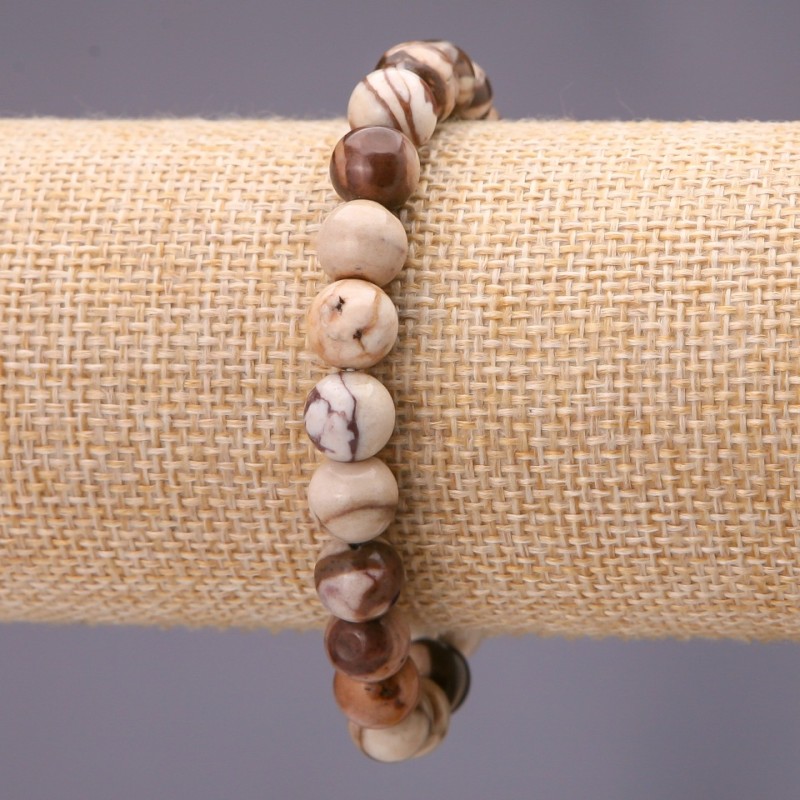 Bransoletka z naturalnego jaspisu, gładka kula o średnicy około 10 mm, na elastycznej gumce, obwód 18 cm
