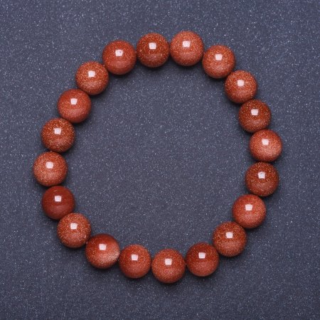 Bransoletka z awenturynu „Złoty piasek” (syntetyczny) gładka kulka na gumce, długość 18 cm, średnica 8 mm