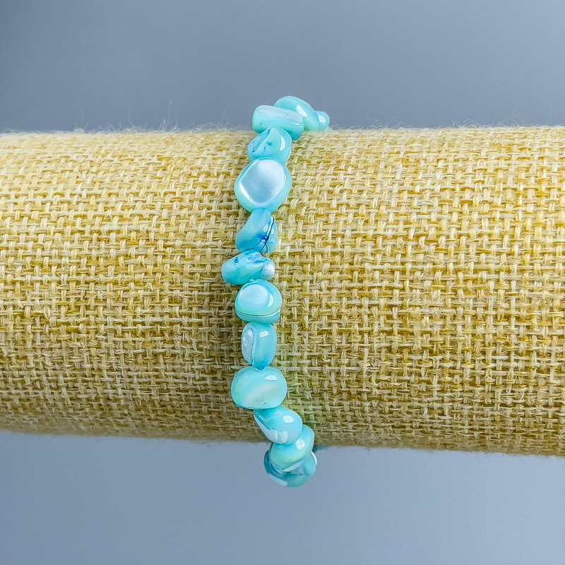 Bransoletka z niebieskiej masy perłowej, fasetowana, średnica 8×6 mm, długość 18 cm (rozciągliwa)