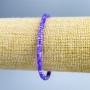 Bransoletka z tonowanej fioletowej masy perłowej w kształcie talerzyków, o średnicy 4×2 mm, długość 18 cm (rozciągliwa)