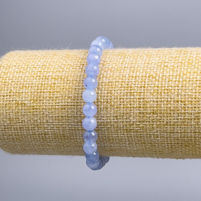 Bransoleta z akwamarynu, gładkie kuleczki, średnica 6,5 mm, długość 18 cm (rozciągana)