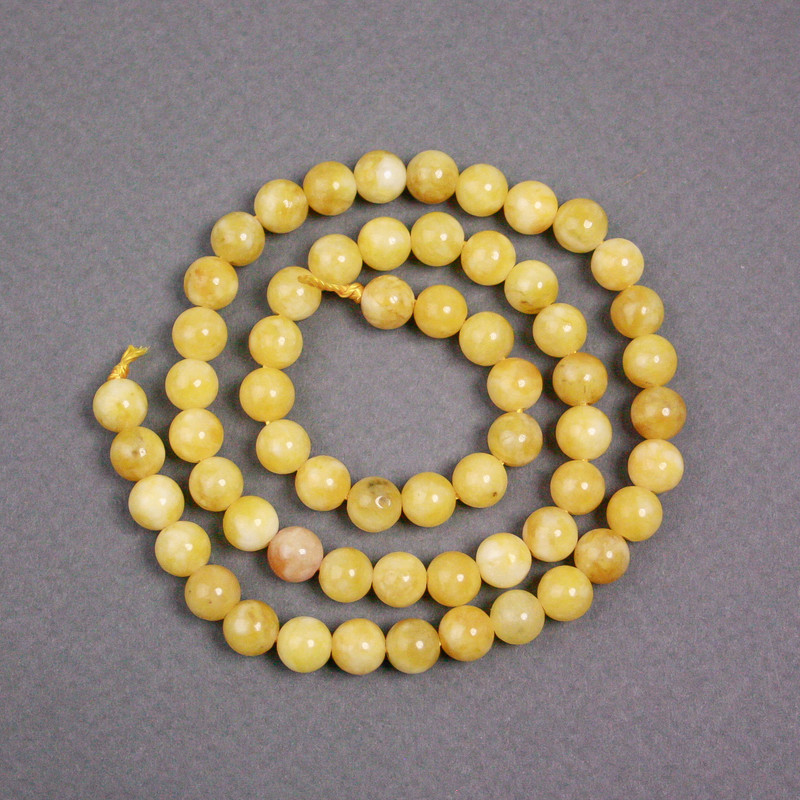 Koraliki na nici żółty jadeit, gładkie kuleczki, średnica 6,5 mm, długość 38 cm