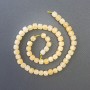 Koraliki cytrynowe z naturalnego kamienia, fasetowane kostki o wymiarach 7×7 mm, długość około 39 cm, na nici