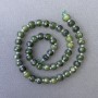 Koraliki jadeitu kanadyjskiego, naturalny kamień fasetowany w kształcie rondela, na nitce, średnica około 7,5×6 mm, długość około 38 cm, z drobnymi koralikami 3×2 mm