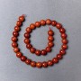 Koraliki z czerwonej jaspisu (prasowane) gładkie kuleczki, średnica 10 mm ±, długość 39 cm ± na nitce