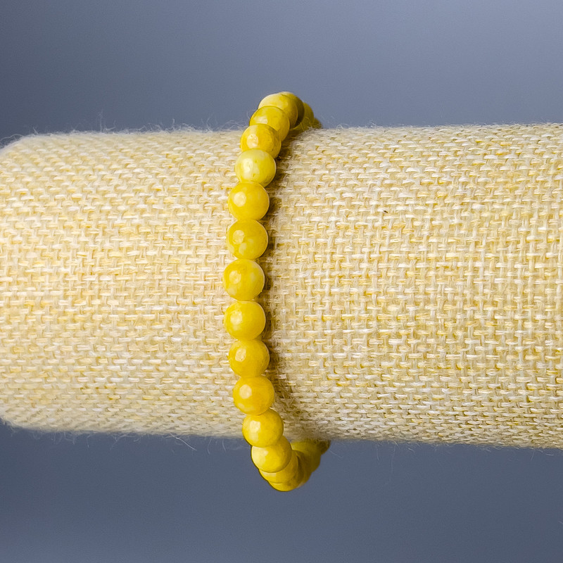 Bransoletka z żółtego jadeitu — gładka kuleczka, średnica 6,5 mm, długość 18 cm (rozciągana)