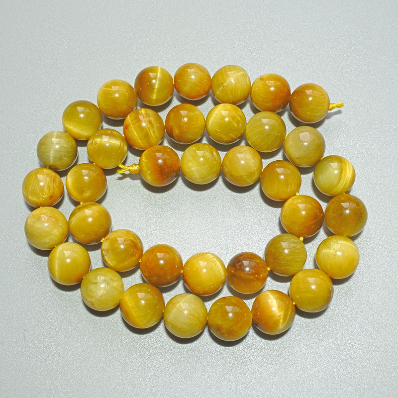 Koraliki Żółte Kocie Oko z naturalnego kamienia, gładkie kulki, średnica ok. 10 mm, długość ok. 38 cm, na nitce