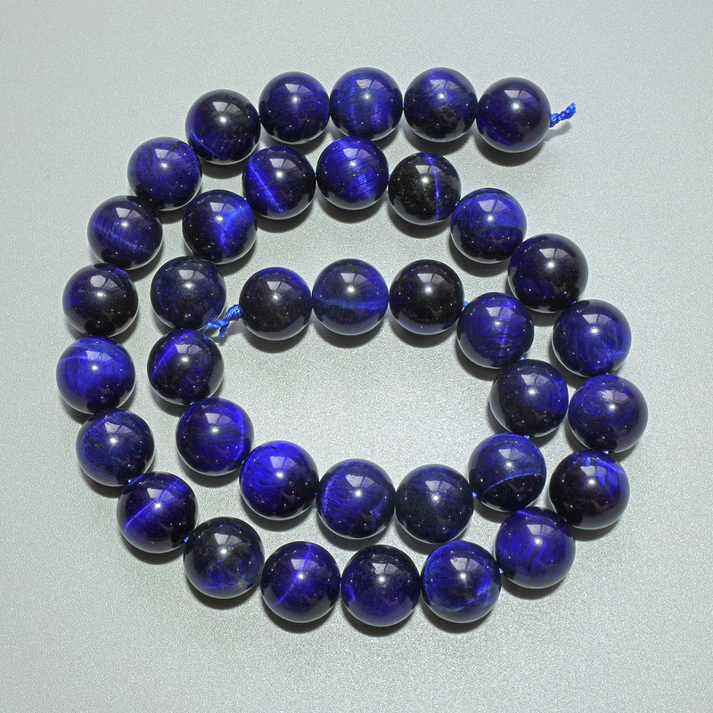 Koraliki niebieskie Kocie Oko z naturalnego kamienia, gładkie kulki, średnica 10 mm, długość około 38 cm, na nici