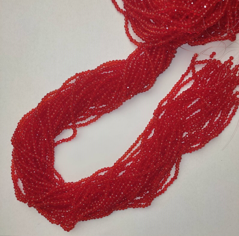 Koraliki czeskiego kryształu czerwone, przezroczyste, fasetowane rondelki, średnica 3×2,5 mm, długość 39 mm, na żyłce