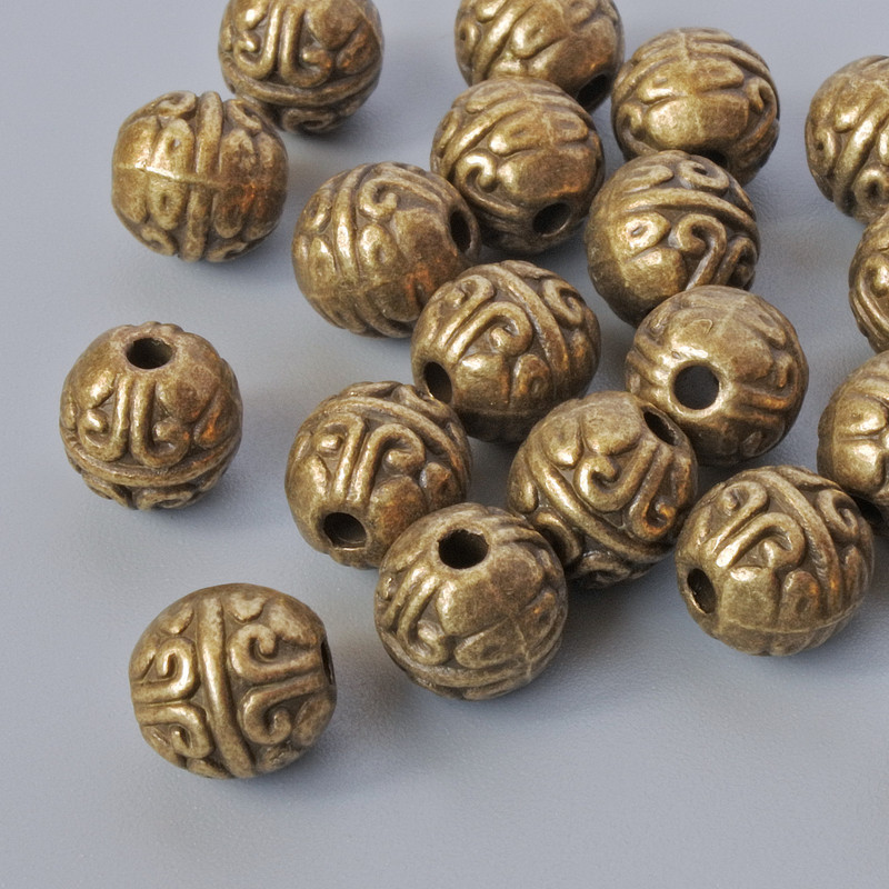 Brązowe koraliki-wkładki, średnica 7 mm, średnica otworu 1,7 mm, opakowanie 16 szt. ± brązowy kolor metalu