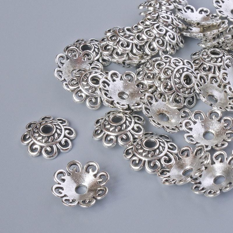 Końcówka jubilerska, średnica 12x2 mm, średnica otworu 2,3 mm, opakowanie 20 g ±, srebrny kolor metalu