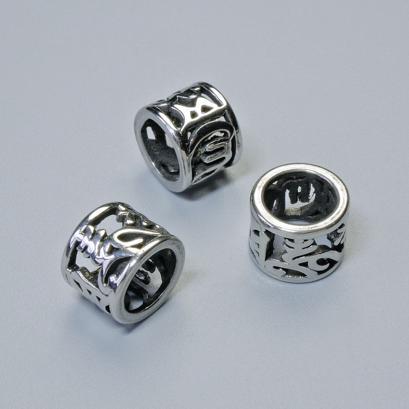 Koralik-wkładka jubilerska, średnica 6,5×8 mm, otwór średnicy ok. 5,9 mm, srebrzysty kolor metalu, 1 szt.