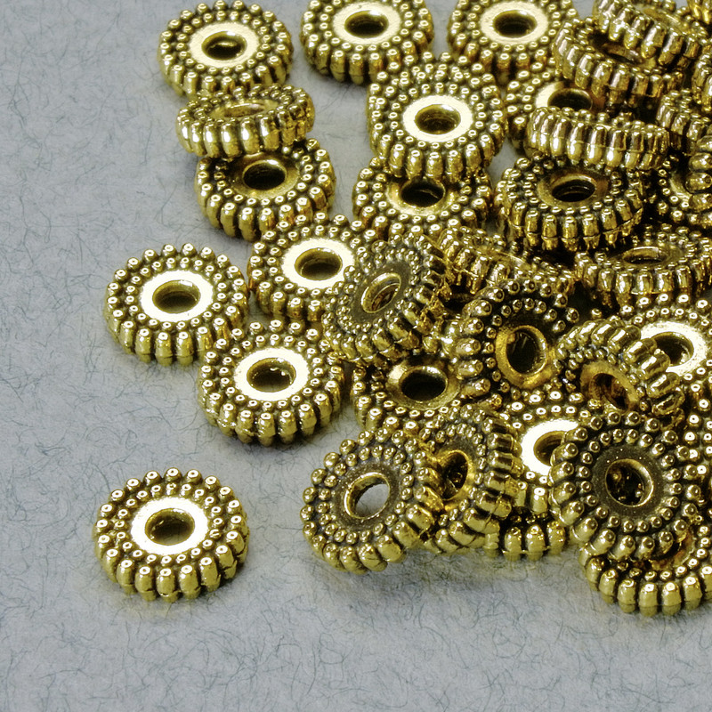 Złota koralik-wkładka, średnica 2×7 mm +/-, otwór 1,8 mm, złoty kolor metalu, opakowanie 36 szt.