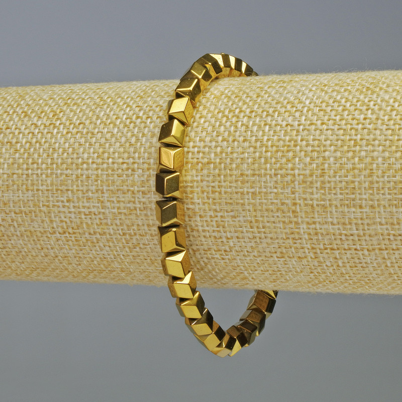 Bransoletka hematyt w kształcie sześciokątów z wzorem zig-zag, kolor złoty, średnica 6×6 mm ±, długość 18 cm ±, elastyczna