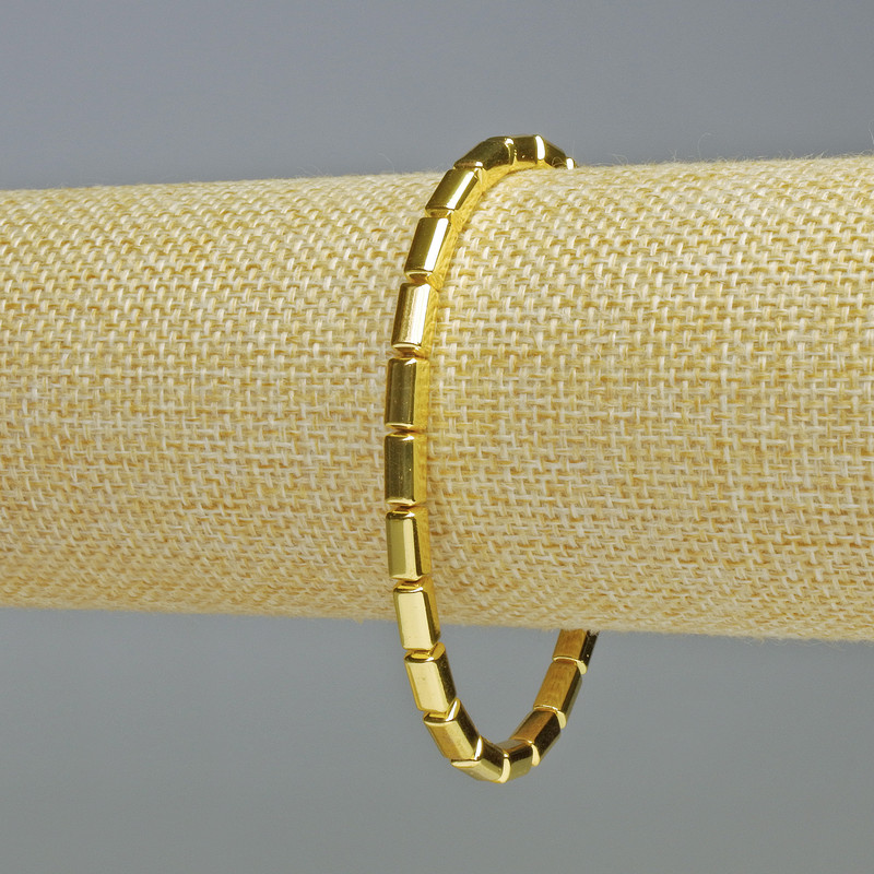 Bransoletka z hematitu w prostokątnym, zaokrąglonym kształcie, kolor złoty, średnica 8x4 mm, długość 18 cm, na elastycznej gumce