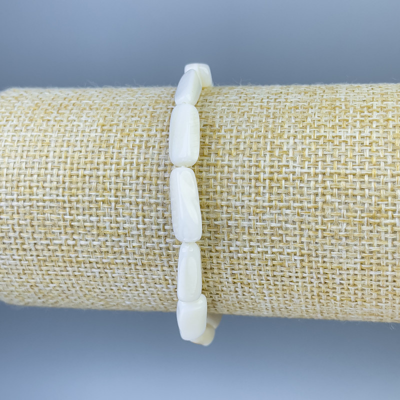 Bransoletka z naturalnej masy perłowej, fasetowane kulki 14×5 mm, długość 18 cm, elastyczna