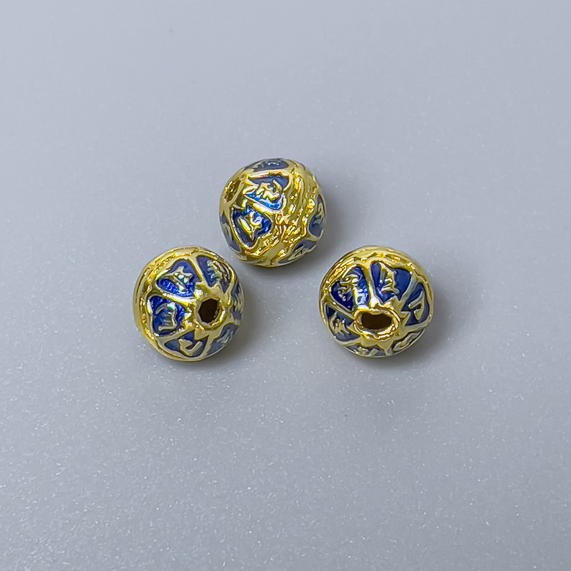 Koralik Cloisonné niebieska emalia, średnica około 7×6 mm, otwór około 1 mm, złoty kolor metalu, 1 szt.