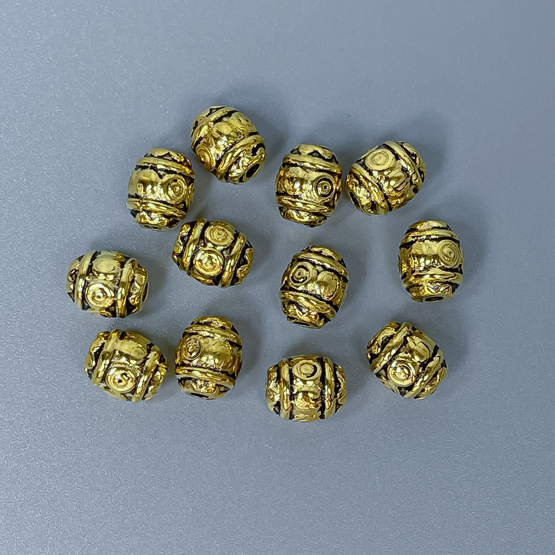 Koralik-wstawka w kolorze złotym, średnica 6×7 mm, średnica otworu ~1,5 mm, opakowanie 20 g (~26 szt.)