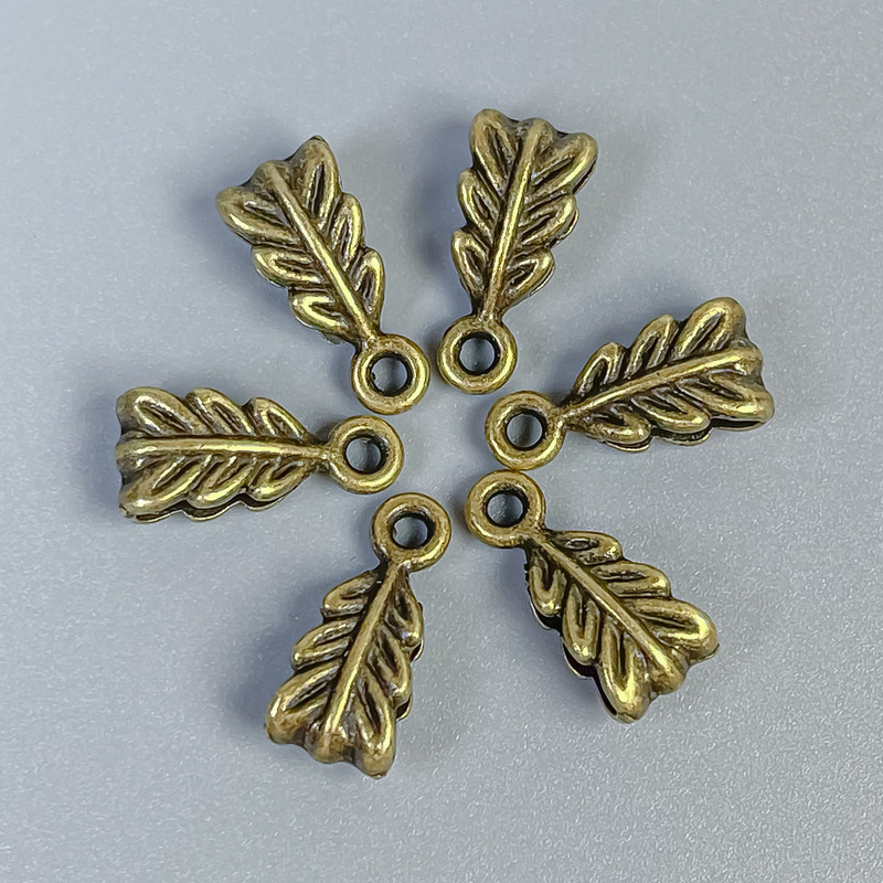 Bajl w kolorze brązu, rozmiar 14×7×5 mm, otwory 2,5 mm i 1,8 mm, opakowanie 22 szt.