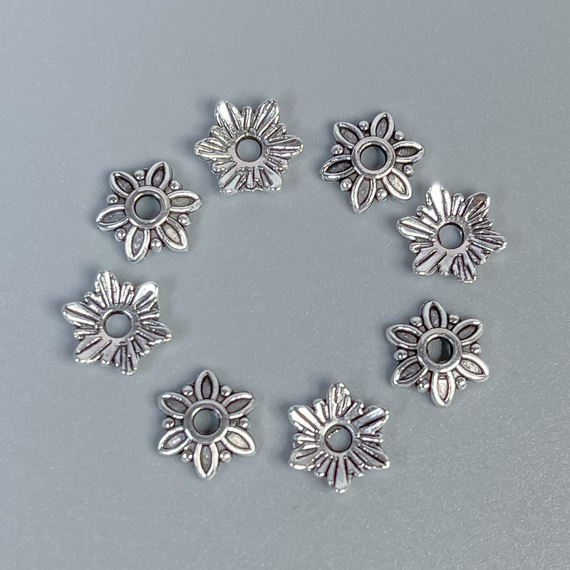 Kapturek do koralików, kolor metalu srebrny, średnica 7×1 mm i otwór 1,5 mm ± opakowanie 80 szt.