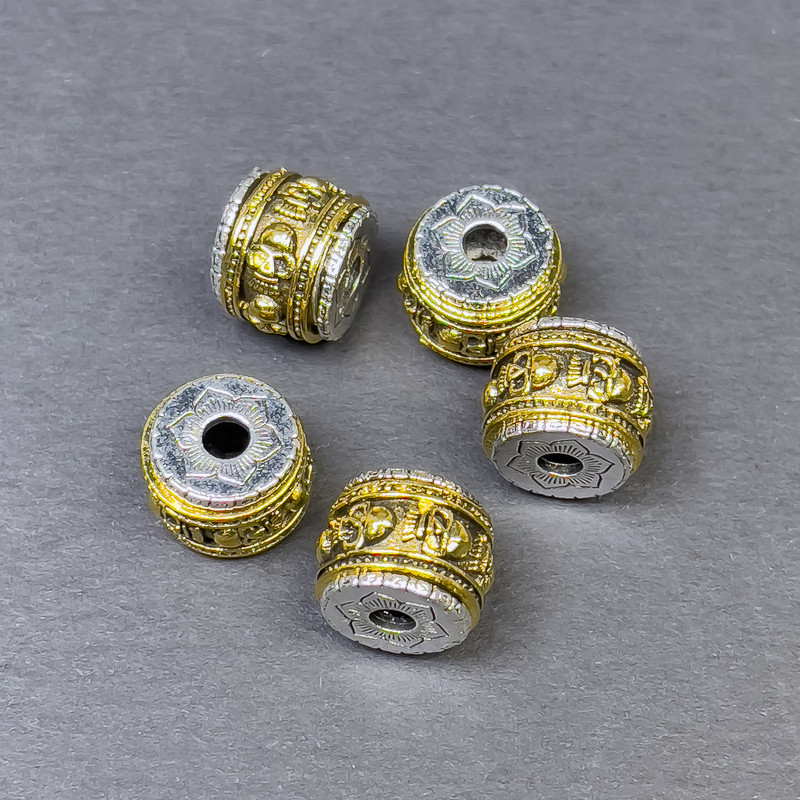 Koralik-wstawka do biżuterii, kolor metalu srebrzysto-złoty, średnica 9×11 mm, otwór około 3 mm, cena za 1 sztukę