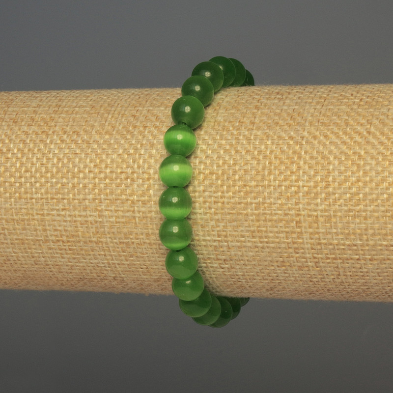 Bransoletka z zielonego kociego oka, gładkie kuleczki, średnica ok. 8 mm, długość ok. 18 mm, elastyczna