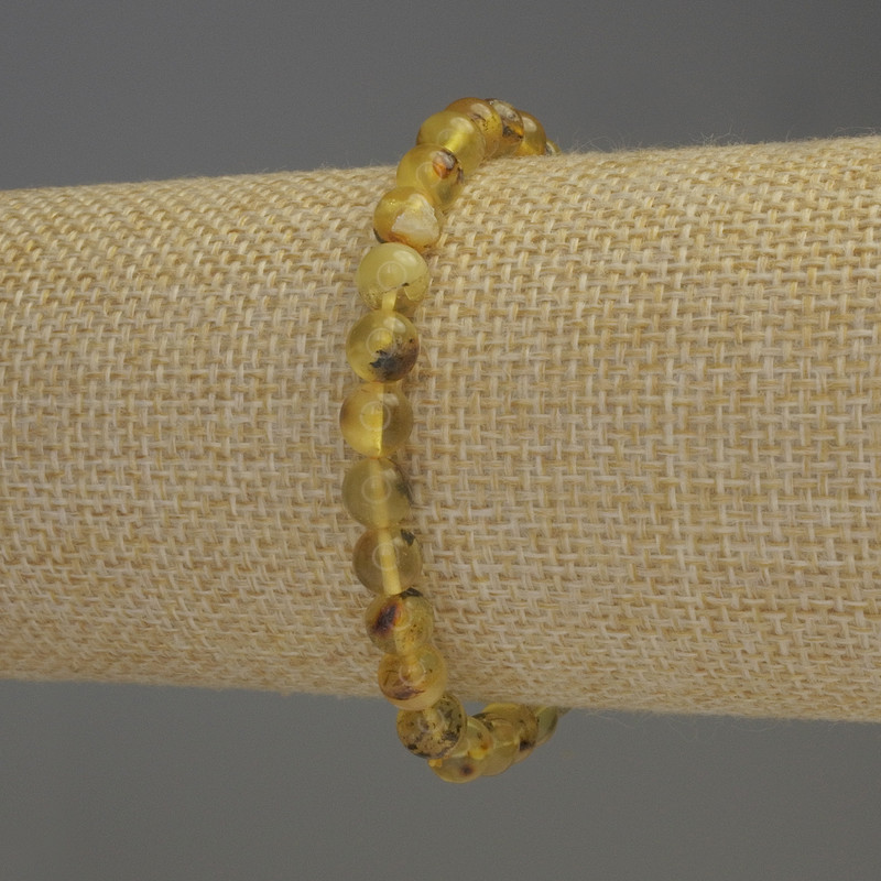 Bransoletka z bursztynu, gładkie kuleczki, średnica 6–6,5 mm, długość 18 cm, elastyczna