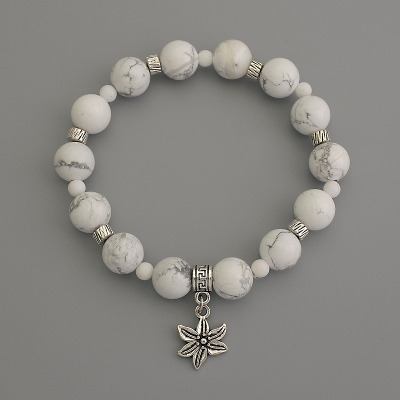 Bransoletka z kuleczek kaholongu, średnica około 10 mm, kuleczki agatowe 4 mm, z metalowymi wstawkami, długość 18 cm, elastyczna