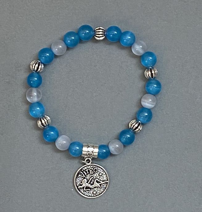 Bransoletka z asortymentu „Kocie Oko” — gładka kulka 8 mm +- z metalowymi wstawkami, długość 18 mm +- elastyczna