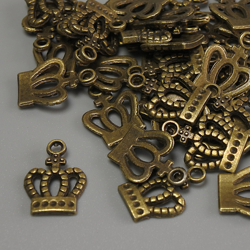 Zawieszka Korona, kolor metalu: brązowy, rozmiary 15x10x1 mm ± otwór 2 mm ± opakowanie 20 g (~36 szt.)