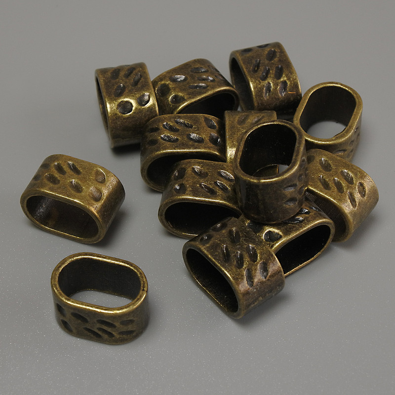 Rozdzielacz rzędów – wstawka w kolorze brązu, średnica 13×9 mm ± otwór, średnica 11×7 mm ± opakowanie 20 g (~13 szt.)