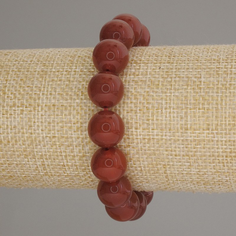 Bransoletka z karneolu, gładkie kuleczki, średnica 12 mm ±, długość 18 cm ±, elastyczna