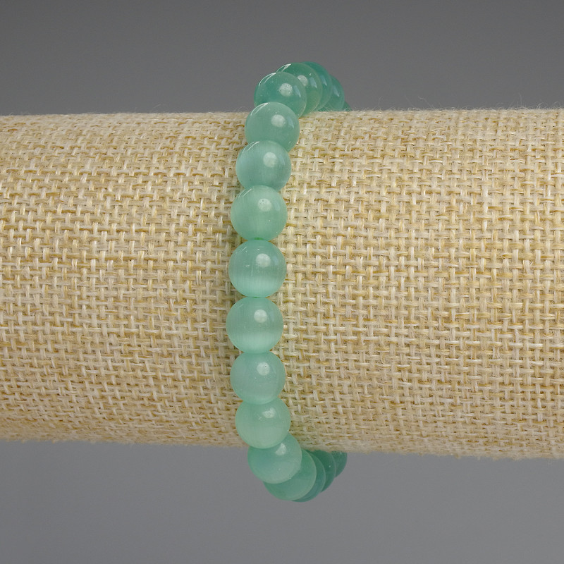 Bransoletka z kamieniem kocie oko, gładkie kulki o średnicy 8 mm, długość ok. 18 cm, elastyczna