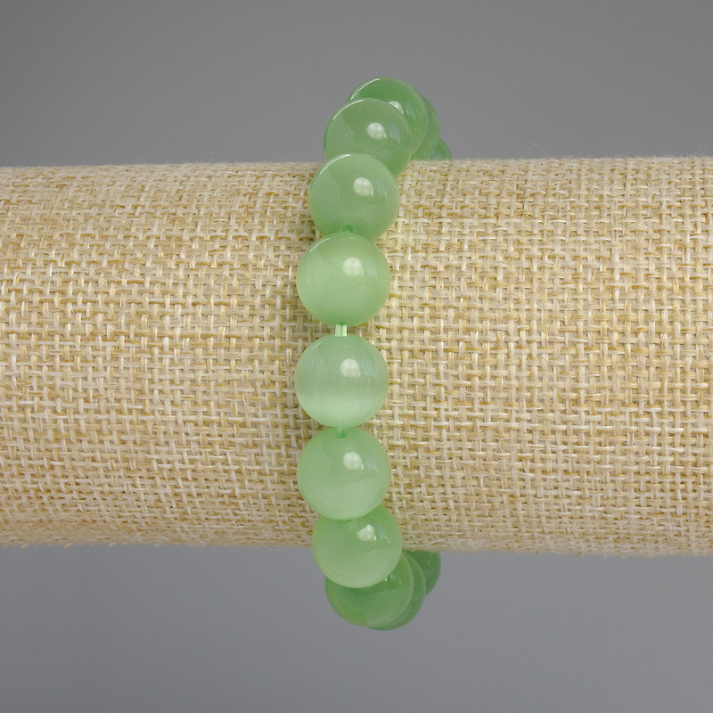 Bransoletka z kamienia kocie oko — gładkie kule o średnicy 11,5 mm, długość 18 cm, elastyczna