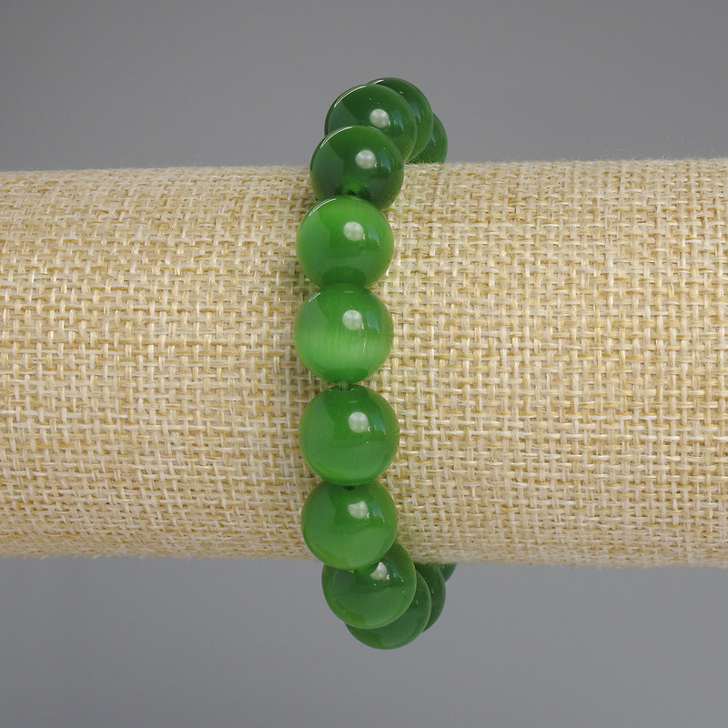Bransoletka z kamienia kociego oka — gładkie kule, średnica około 9,5 mm, długość 18 cm, elastyczna