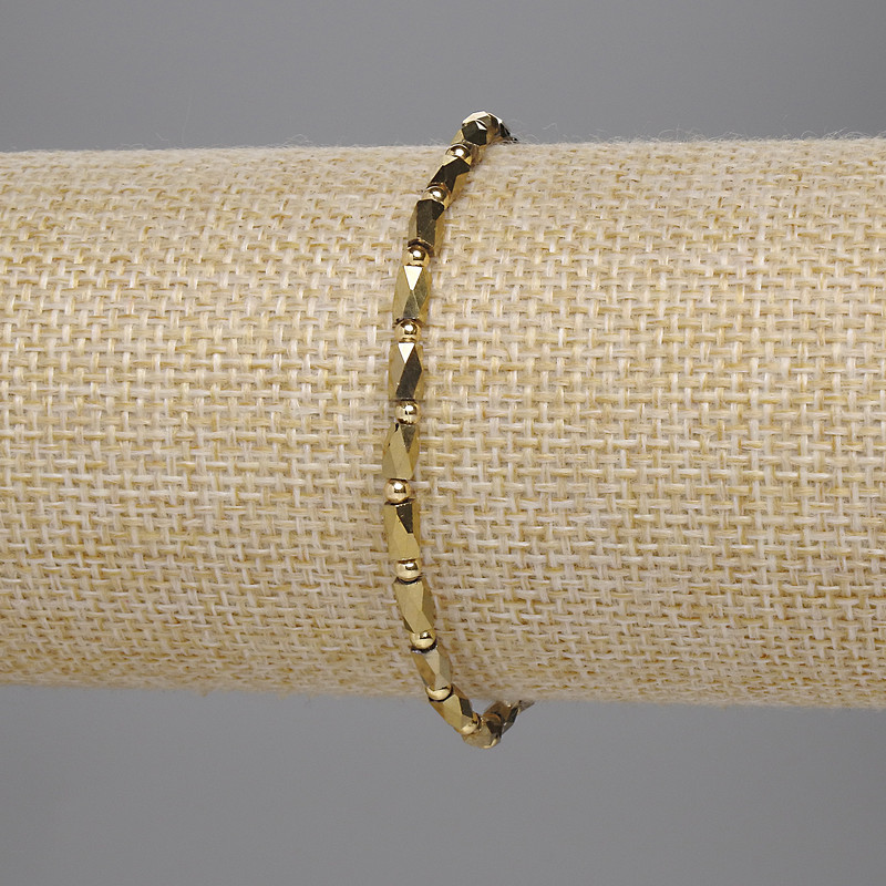 Bransoleta z czeskiego kryształu, złocisty odcień, fasetowane cylindry 5×3 mm, kuleczka 2 mm, długość 18 cm, elastyczna