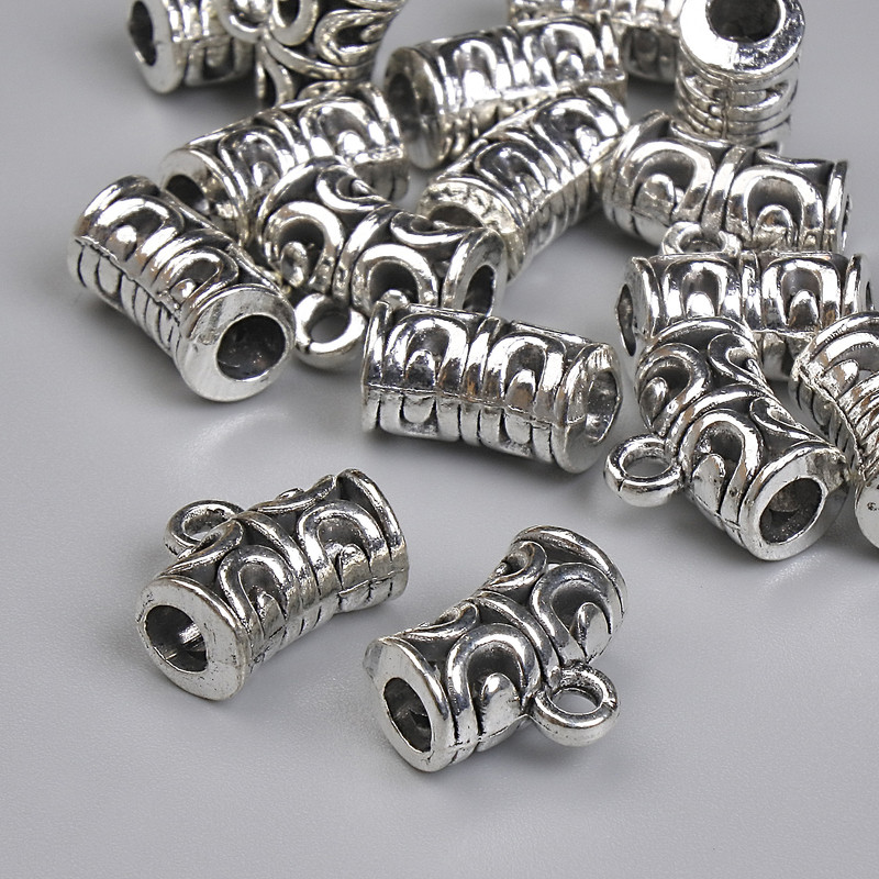 Bajl srebrzysty (kolor metalu), wymiary 12×6 mm ±, otwory 3 mm ±, średnica 2 mm ±, opakowanie 20 g (~17 szt.)