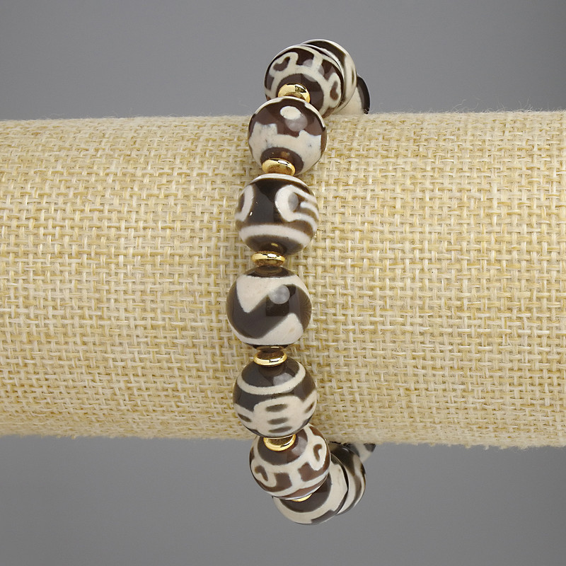 Bransoletka z agatu, gładka kuleczka, średnica około 12 mm, z metalowymi wstawkami, długość 18 cm ± elastyczna