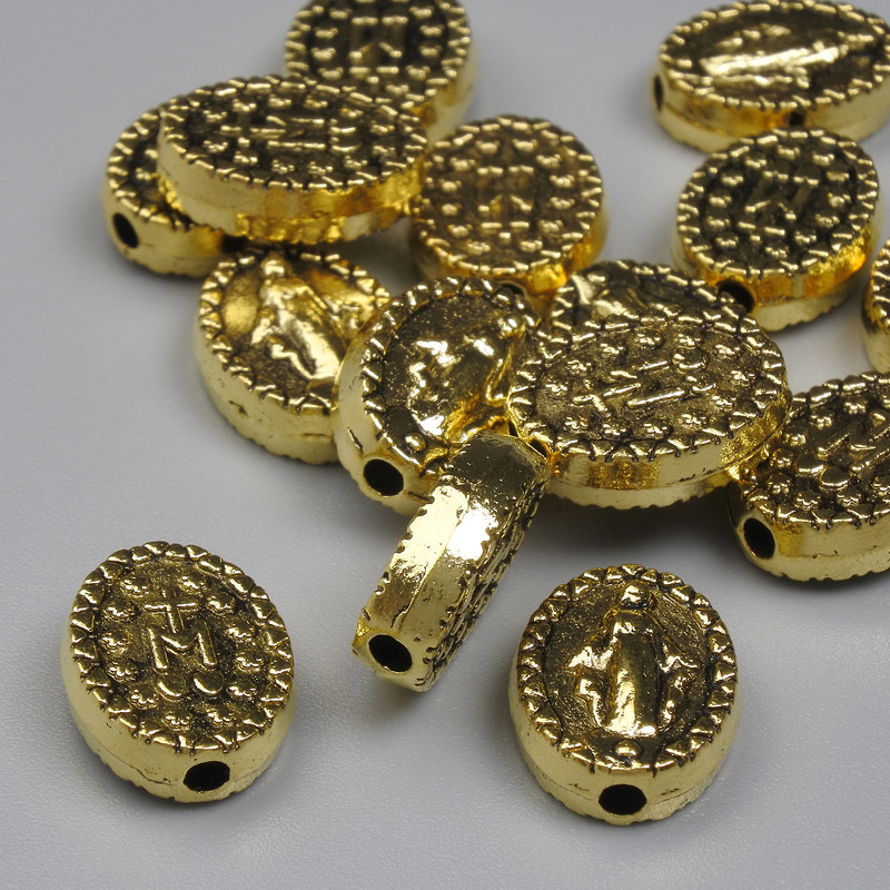 Złocista wkładka koralika — kolor metalu złoty, średnica 11,5×9 mm, otwór Ø 1,7 mm, opakowanie 20 g (~15 szt.)