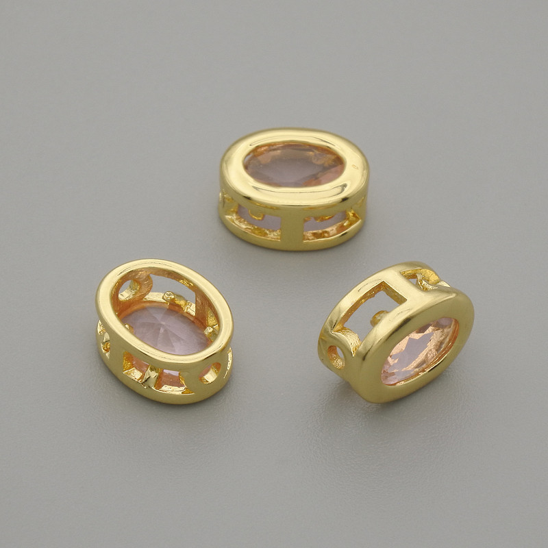Koralik-wstawka owalny z różowym kryształem w złoceniu, średnica 9×7 mm, otwór 1,3 mm, na 1 szt. +