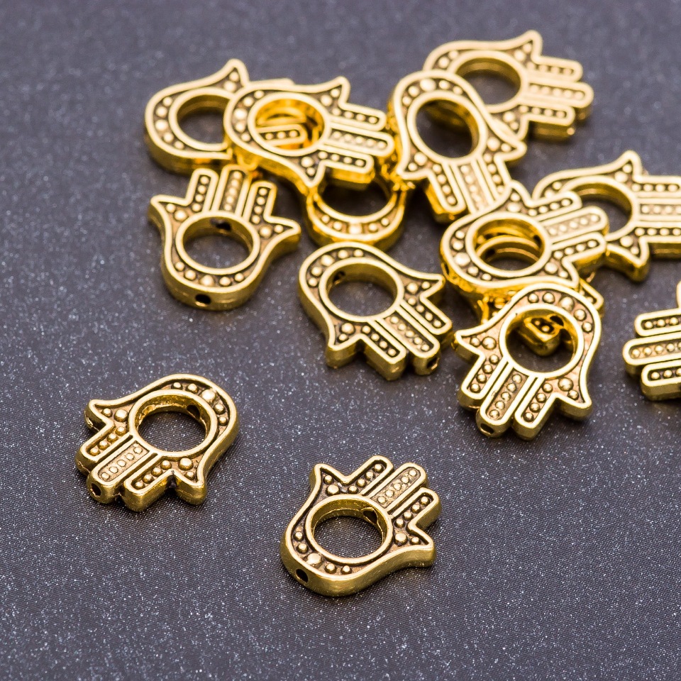Koralik-wstawka w kształcie dłoni, kolor «stare złoto», średnica 14×12×2,5 mm, otwór 5 mm, opakowanie 20 g ± 19 szt.